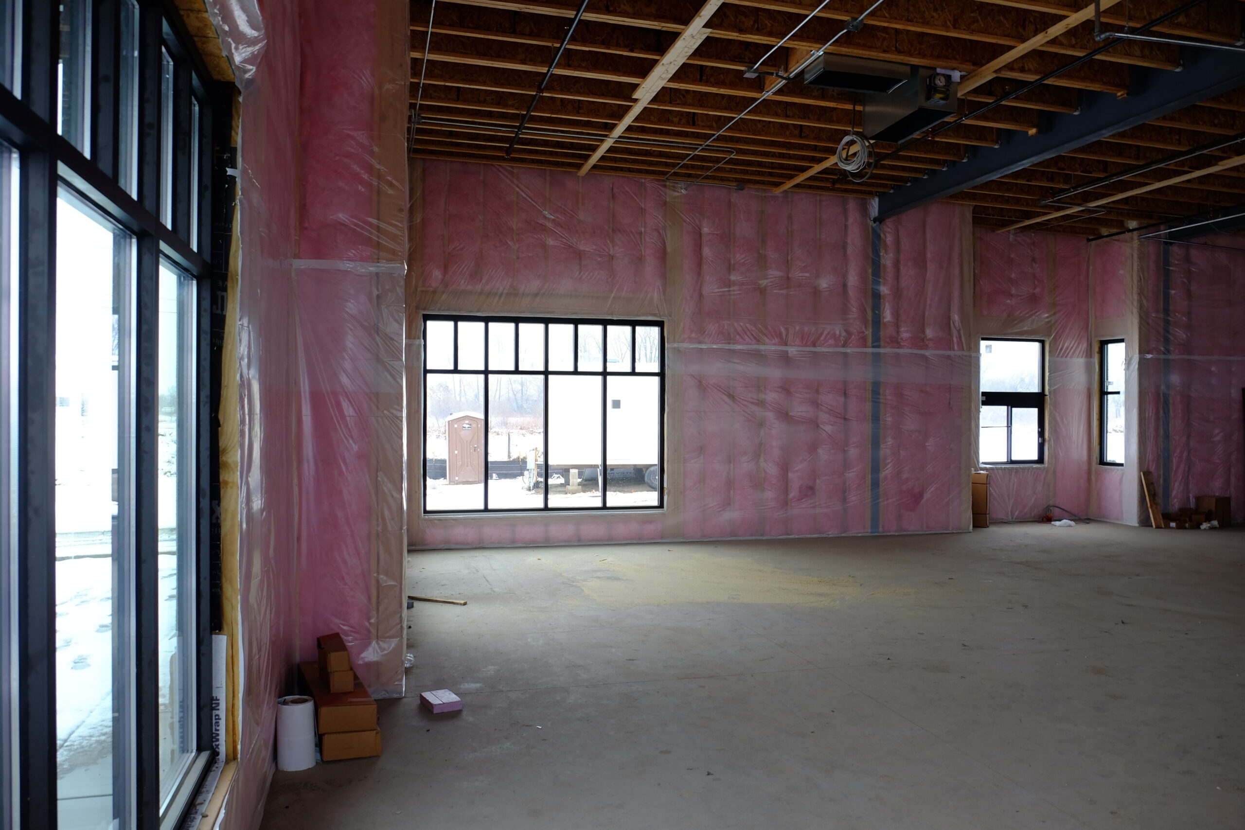 Empty room with pink insulation walls